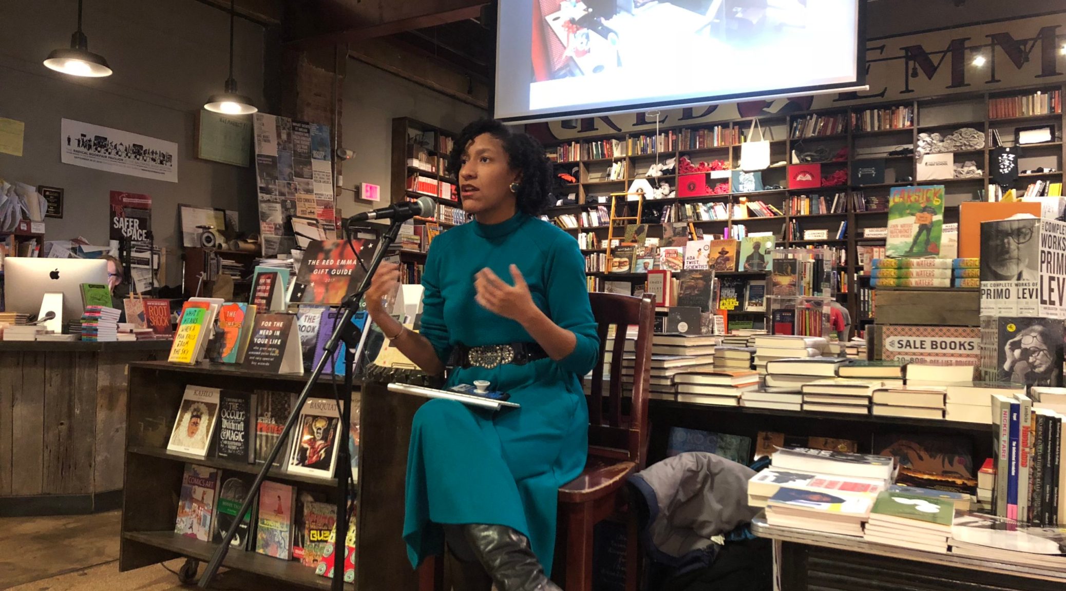 Kristen Jeffers Kristen Jeffers seated, speaking at a bookstore